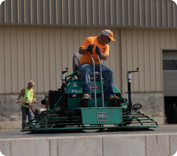 workers on a machine at a project site